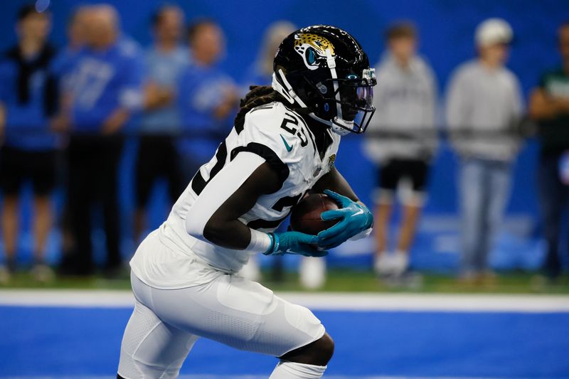 Jacksonville Jaguars running back D'Ernest Johnson (25) warms up before the first half of a preseason NFL football game between the Detroit Lions and the Jacksonville Jaguars, Saturday, Aug. 19, 2023, in Detroit. (AP Photo/Duane Burleson)