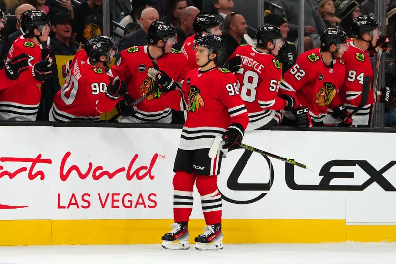 Oct 27, 2023; Las Vegas, Nevada, USA; Chicago Blackhawks center Connor Bedard (98) celebrates with team mates after scoring a goal against the Vegas Golden Knights during the first period at T-Mobile Arena. Mandatory Credit: Stephen R. Sylvanie-USA TODAY Sports