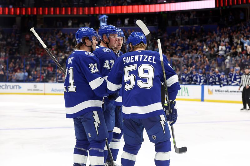 Nov 18, 2025; Tampa, Florida, USA; Tampa Bay Lightning defenseman Darren Raddysh (43) is congratulated  after he scored a goal against the New Jersey Devils  during the third period at Benchmark International Arena. Mandatory Credit: Kim Klement Neitzel-Imagn Images