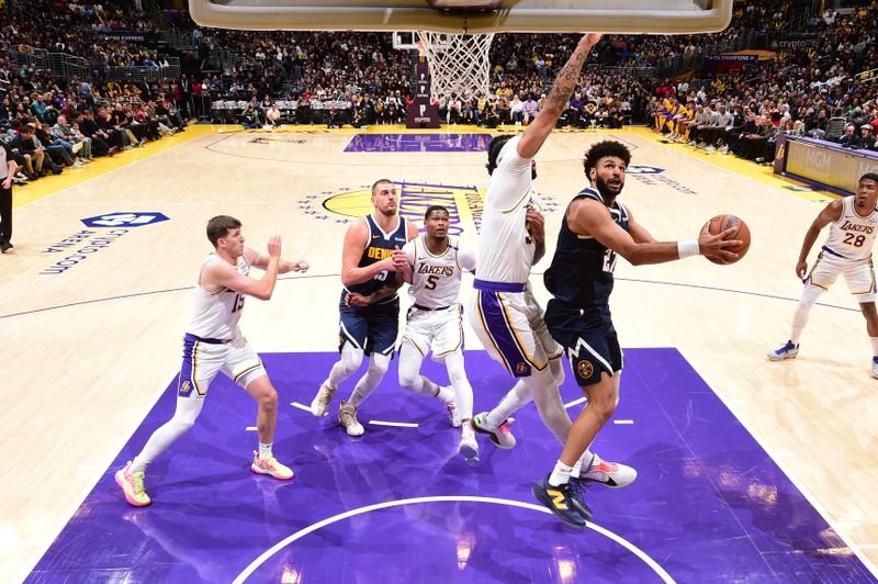 LOS ANGELES, CA - NOVEMBER 23: Jamal Murray #27 of the Denver Nuggets drives to the basket during the game against the Los Angeles Lakers on November 23, 2024 at Crypto.Com Arena in Los Angeles, California. NOTE TO USER: User expressly acknowledges and agrees that, by downloading and/or using this Photograph, user is consenting to the terms and conditions of the Getty Images License Agreement. Mandatory Copyright Notice: Copyright 2024 NBAE (Photo by Adam Pantozzi/NBAE via Getty Images)