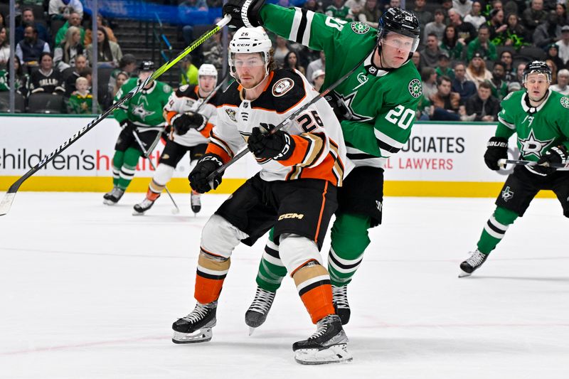 Jan 25, 2024; Dallas, Texas, USA; Anaheim Ducks left wing Brock McGinn (26) and Dallas Stars defenseman Ryan Suter (20) chase the puck in the Dallas zone during the first period at the American Airlines Center. Mandatory Credit: Jerome Miron-USA TODAY Sports