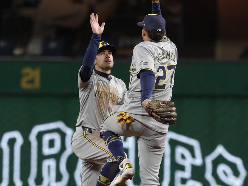 Apr 24, 2024; Pittsburgh, Pennsylvania, USA;  Milwaukee Brewers right fielder Sal Frelick (left) and shortstop Willy Adames (27) celebrate after defeating the Pittsburgh Pirates at PNC Park. The Brewers won 3-2. Mandatory Credit: Charles LeClaire-USA TODAY Sports