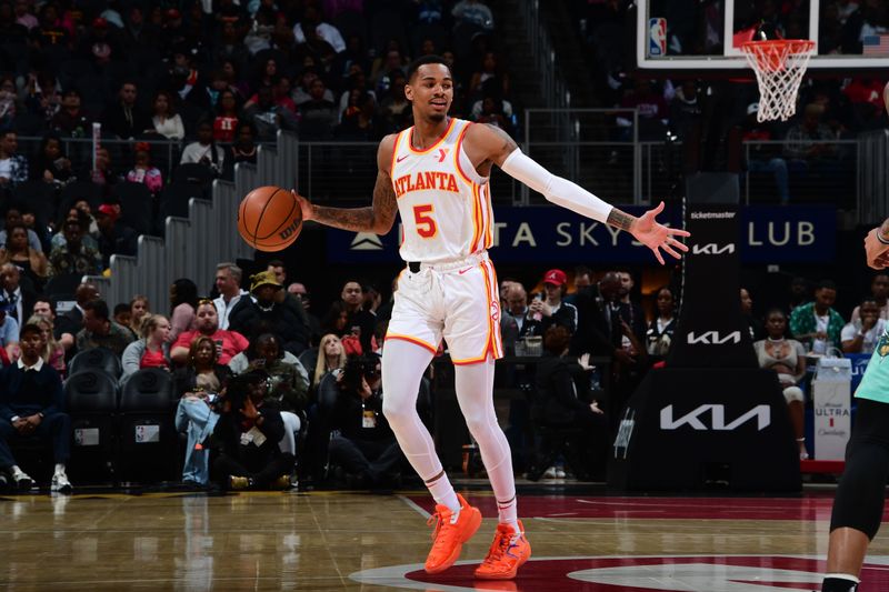 ATLANTA, GA - MARCH 23: Dejounte Murray #5 of the Atlanta Hawks dribbles the ball during the game against the Charlotte Hornets on March 23, 2024 at State Farm Arena in Atlanta, Georgia.  NOTE TO USER: User expressly acknowledges and agrees that, by downloading and/or using this Photograph, user is consenting to the terms and conditions of the Getty Images License Agreement. Mandatory Copyright Notice: Copyright 2024 NBAE (Photo by Scott Cunningham/NBAE via Getty Images)