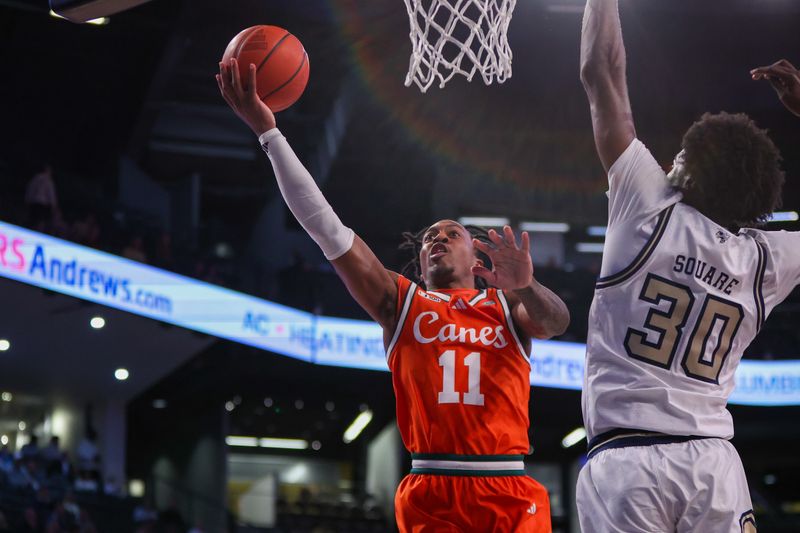 Mar 4, 2025; Atlanta, Georgia, USA; Miami Hurricanes guard A.J. Staton-McCray (11) shoots against the Georgia Tech Yellow Jackets in the first half at McCamish Pavilion. Mandatory Credit: Brett Davis-Imagn Images