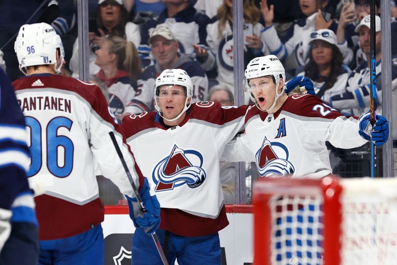 Apr 21, 2024; Winnipeg, Manitoba, CAN; Colorado Avalanche center Nathan MacKinnon (29) celebrates his first period goal against the Winnipeg Jets in game one of the first round of the 2024 Stanley Cup Playoffs at Canada Life Centre. Mandatory Credit: James Carey Lauder-USA TODAY Sports