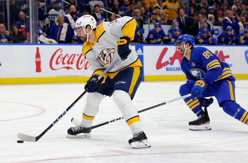 Dec 3, 2023; Buffalo, New York, USA;  Nashville Predators left wing Filip Forsberg (9) looks to take a shot on goal as Buffalo Sabres right wing Alex Tuch (89) defends during the third period at KeyBank Center. Mandatory Credit: Timothy T. Ludwig-USA TODAY Sports