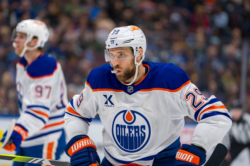 Nov 9, 2024; Vancouver, British Columbia, CAN; Edmonton Oilers forward Leon Draisaitl (29) prepares for a face off against the Vancouver Canucks during the first period at Rogers Arena. Mandatory Credit: Bob Frid-Imagn Images