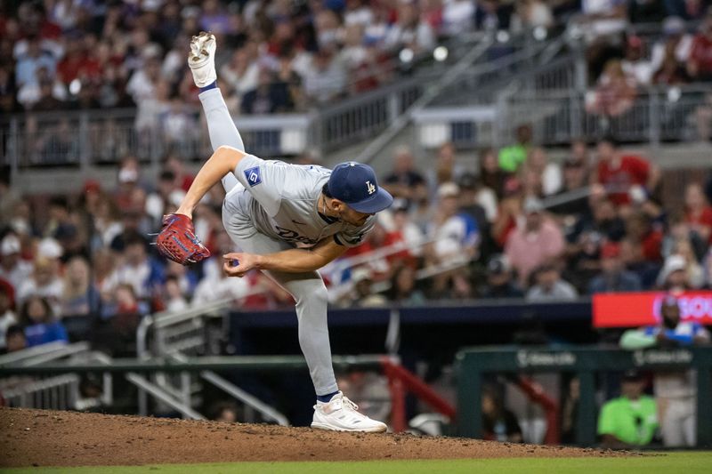 Sep 14, 2024; Cumberland, Georgia, USA; Los Angeles Dodgers pitcher Alex Vesia (51) pitches against the Atlanta Braves during the fourth inning at Truist Park. Mandatory Credit: Jordan Godfree-Imagn Images