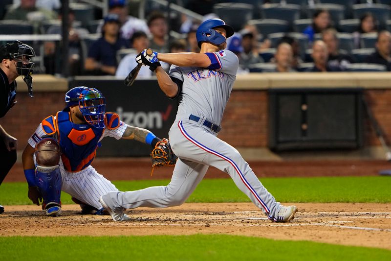 Aug 30, 2023; New York City, New York, USA;  Texas Rangers shortstop Corey Seager (5) hits a home run against the New York Mets during the fourth inning at Citi Field. Mandatory Credit: Gregory Fisher-USA TODAY Sports