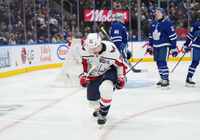 Dec 6, 2024; Toronto, Ontario, CAN; Washington Capitals center Nic Dowd (26) celebrates after scoring a goal against the Toronto Maple Leafs during the second period at Scotiabank Arena. Mandatory Credit: Nick Turchiaro-Imagn Images