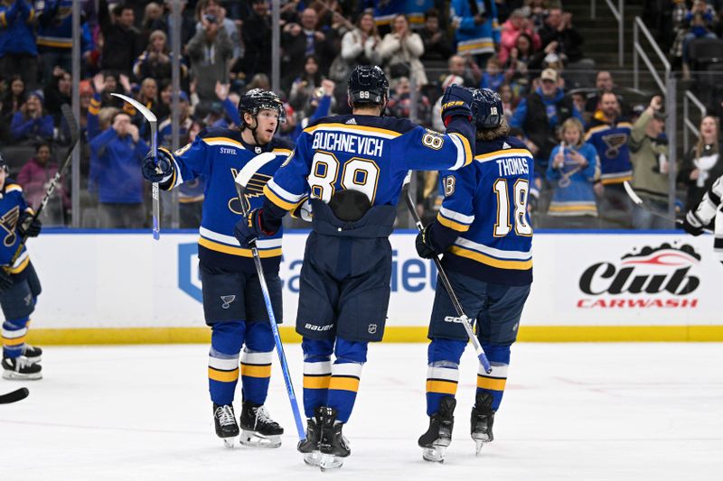 Jan 28, 2024; St. Louis, Missouri, USA; St. Louis Blues left wing Pavel Buchnevich (89) is congratulated by teammates after scoring a goal against the Los Angeles Kings during the second period at Enterprise Center. Mandatory Credit: Jeff Le-USA TODAY Sports