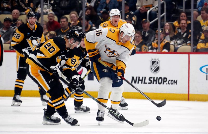 Apr 15, 2024; Pittsburgh, Pennsylvania, USA;  Nashville Predators left wing Cole Smith (36) moves the puck against Pittsburgh Penguins center Lars Eller (20) during the third period at PPG Paints Arena. The Penguins won 4-2. Mandatory Credit: Charles LeClaire-USA TODAY Sports