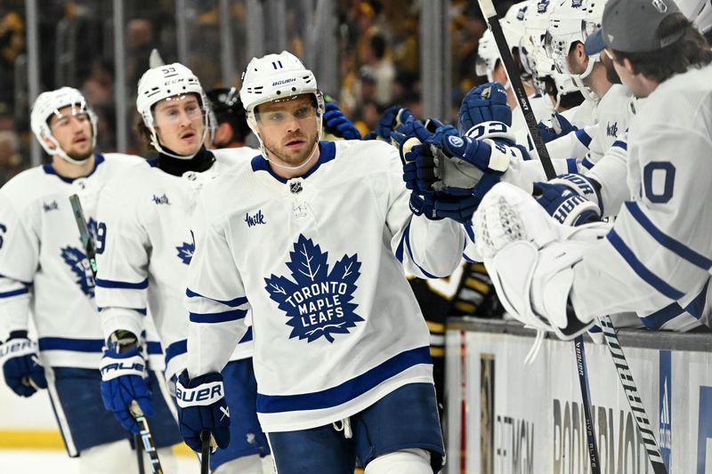 Apr 22, 2024; Boston, Massachusetts, USA; Toronto Maple Leafs center Max Domi (11) celebrates with his teammates after scoring a goal against the Boston Bruins during the first period in game two of the first round of the 2024 Stanley Cup Playoffs at TD Garden. Mandatory Credit: Brian Fluharty-USA TODAY Sports