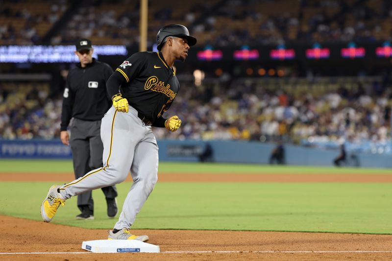 Aug 10, 2024; Los Angeles, California, USA;  Pittsburgh Pirates third baseman Ke'Bryan Hayes (13) runs around bases after hitting a home run during the ninth inning against the Los Angeles Dodgers at Dodger Stadium. Mandatory Credit: Kiyoshi Mio-USA TODAY Sports