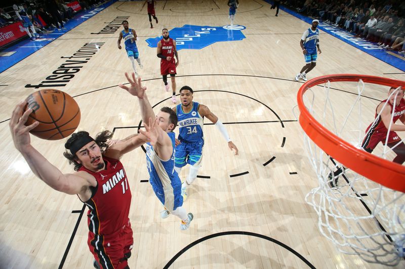 MILWAUKEE, WI - FEBRUARY 13: Jaime Jaquez Jr. #11 of the Miami Heat drives to the basket during the game against the Milwaukee Bucks on February 13, 2024 at the Fiserv Forum Center in Milwaukee, Wisconsin. NOTE TO USER: User expressly acknowledges and agrees that, by downloading and or using this Photograph, user is consenting to the terms and conditions of the Getty Images License Agreement. Mandatory Copyright Notice: Copyright 2024 NBAE (Photo by Gary Dineen/NBAE via Getty Images).