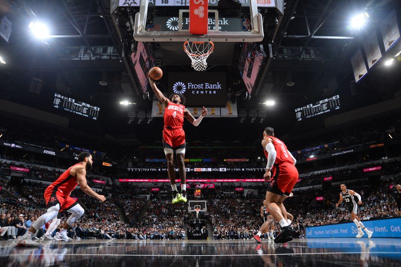 SAN ANTONIO, TX - MARCH 12: Jalen Green #4 of the Houston Rockets grabs the rebound during the game against the San Antonio Spurs on March 12, 2024 at the Frost Bank Center in San Antonio, Texas. NOTE TO USER: User expressly acknowledges and agrees that, by downloading and or using this photograph, user is consenting to the terms and conditions of the Getty Images License Agreement. Mandatory Copyright Notice: Copyright 2024 NBAE (Photos by Michael Gonzales/NBAE via Getty Images)