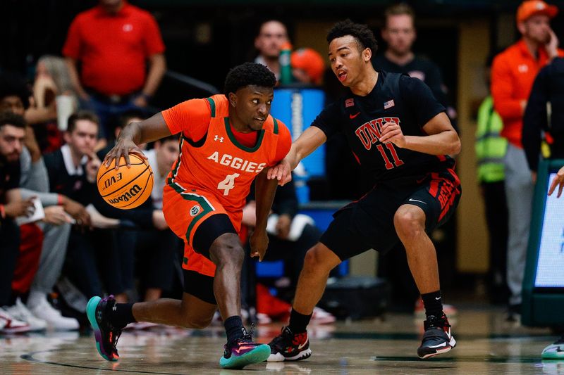 Jan 19, 2024; Fort Collins, Colorado, USA; Colorado State Rams guard Isaiah Stevens (4) controls the ball as UNLV Rebels guard Dedan Thomas Jr. (11) guards in the first half at Moby Arena. Mandatory Credit: Isaiah J. Downing-USA TODAY Sports