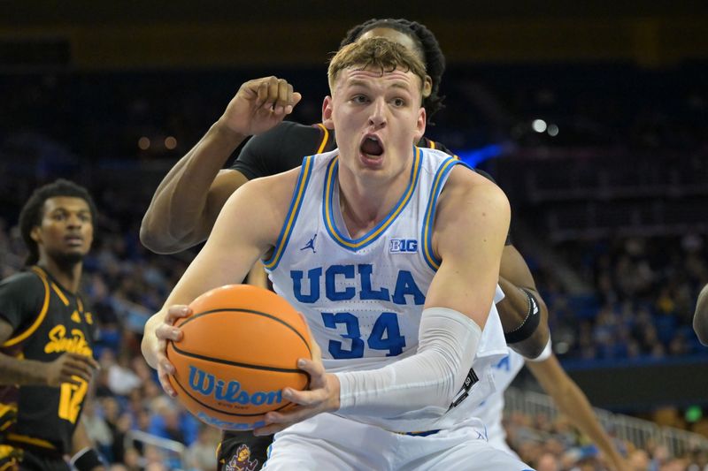 Dec 17, 2025; Los Angeles, California, USA;  UCLA Bruins forward Tyler Bilodeau (34) reaches for a rebound in the first half against the Arizona State Sun Devils at Pauley Pavilion presented by Wescom Financial. Mandatory Credit: Jayne Kamin-Oncea-Imagn Images 