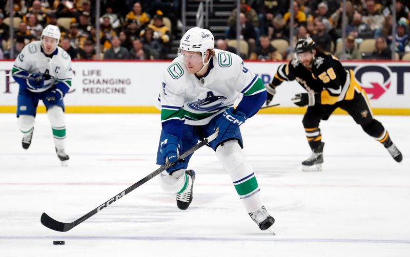 Jan 11, 2024; Pittsburgh, Pennsylvania, USA; Vancouver Canucks right wing Brock Boeser (6) skates up ice with the puck against the Pittsburgh Penguins during the second period at PPG Paints Arena. Mandatory Credit: Charles LeClaire-USA TODAY Sports