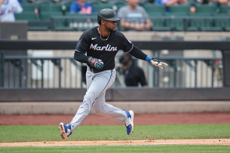 Aug 18, 2024; New York City, New York, USA; Miami Marlins second baseman Otto Lopez (61) rounds third base after hitting a triple during the third inning against the New York Mets at Citi Field. Mandatory Credit: Vincent Carchietta-USA TODAY Sports