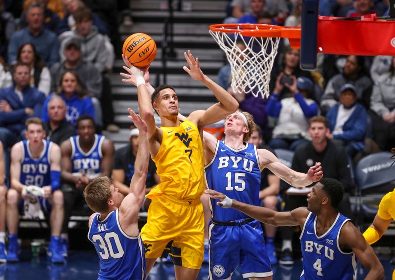 Feb 3, 2024; Morgantown, West Virginia, USA; West Virginia Mountaineers center Jesse Edwards (7) shoots in the lane during the first half against the Brigham Young Cougars at WVU Coliseum. Mandatory Credit: Ben Queen-USA TODAY Sports