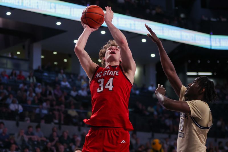 Mar 1, 2025; Atlanta, Georgia, USA; North Carolina State Wolfpack forward Ben Middlebrooks (34) shoots against the Georgia Tech Yellow Jackets in the first half at McCamish Pavilion. Mandatory Credit: Brett Davis-Imagn Images