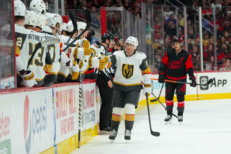 Mar 11, 2023; Raleigh, North Carolina, USA;  Vegas Golden Knights right wing Jonathan Marchessault (81) is congratulated after his goal against the Carolina Hurricanes during the first period at PNC Arena. Mandatory Credit: James Guillory-USA TODAY Sports