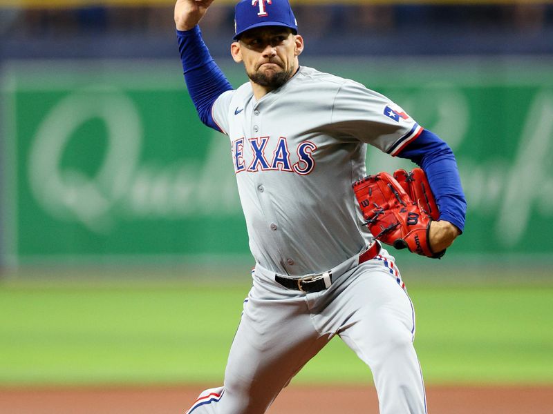 Apr 3, 2024; St. Petersburg, Florida, USA;  Texas Rangers starting pitcher Nathan Eovaldi (17) throws a pitch against the Tampa Bay Rays in the first inning at Tropicana Field. Mandatory Credit: Nathan Ray Seebeck-USA TODAY Sports