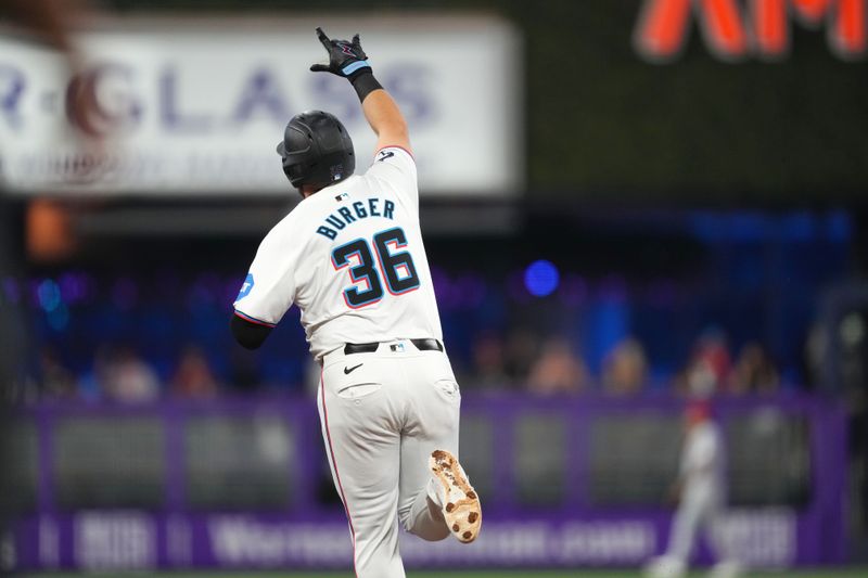 Aug 7, 2024; Miami, Florida, USA;  Miami Marlins designated hitter Jake Burger (36) celebrates a home run in the first inning against the Cincinnati Reds at loanDepot Park. Mandatory Credit: Jim Rassol-USA TODAY Sports