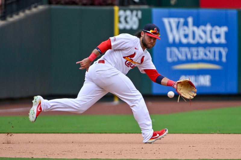 Jul 14, 2024; St. Louis, Missouri, USA;  St. Louis Cardinals third baseman Brandon Crawford (35) fields a ground ball against the Chicago Cubs during the eighth inning at Busch Stadium. Mandatory Credit: Jeff Curry-USA TODAY Sports