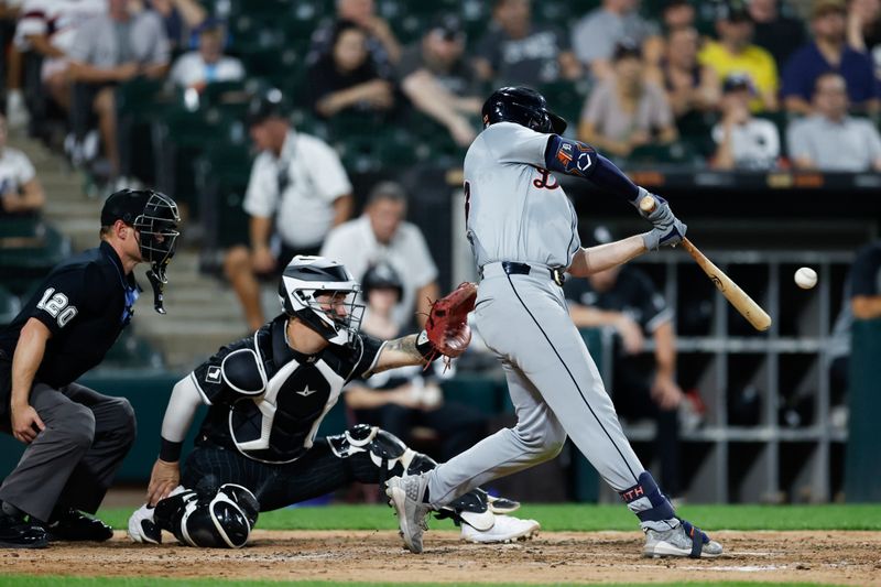 Aug 26, 2024; Chicago, Illinois, USA; Detroit Tigers second baseman Colt Keith (33) hits an RBI-single against the Chicago White Sox during the fifth inning at Guaranteed Rate Field. Mandatory Credit: Kamil Krzaczynski-USA TODAY Sports