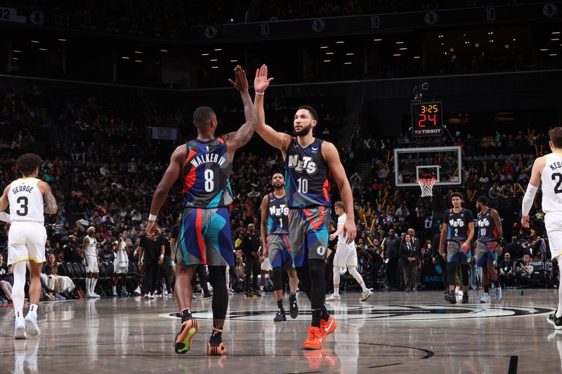 BROOKLYN, NY - JANUARY 29: Ben Simmons #10 high fives Lonnie Walker IV #8 of the Brooklyn Nets during the game against the Utah Jazz on January 29, 2024 at Barclays Center in Brooklyn, New York. NOTE TO USER: User expressly acknowledges and agrees that, by downloading and or using this Photograph, user is consenting to the terms and conditions of the Getty Images License Agreement. Mandatory Copyright Notice: Copyright 2024 NBAE (Photo by Nathaniel S. Butler/NBAE via Getty Images)