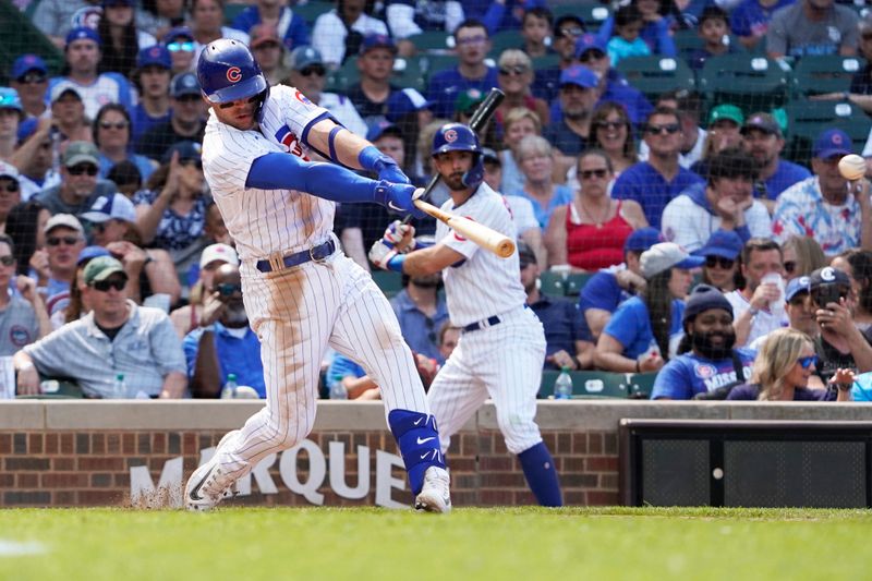 May 31, 2023; Chicago, Illinois, USA; Chicago Cubs designated hitter Nico Hoerner (2) hits a single against the Tampa Bay Rays during the eighth inning at Wrigley Field. Mandatory Credit: David Banks-USA TODAY Sports