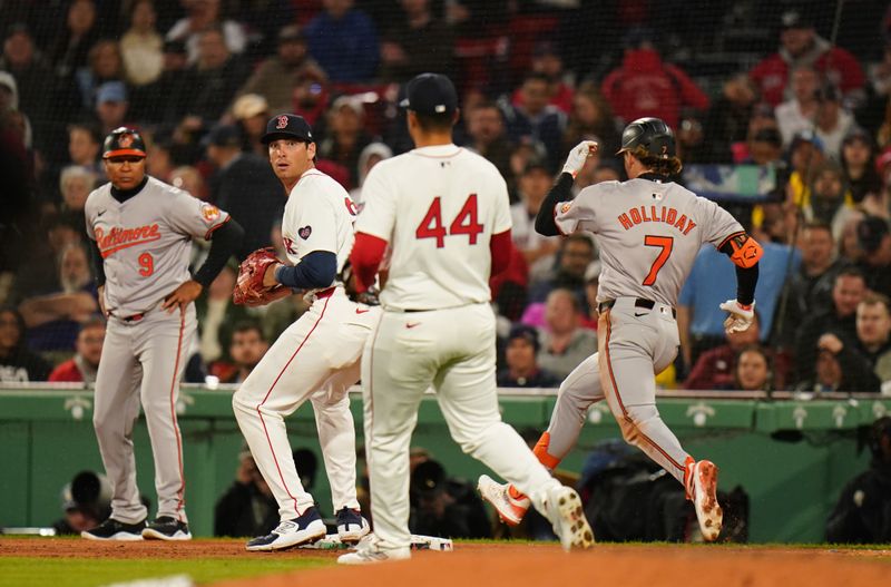 Apr 10, 2024; Boston, Massachusetts, USA; Baltimore Orioles second base Jackson Holliday (7) grounds out at first base but drives in a run against the Boston Red Sox in the sixth inning at Fenway Park. Mandatory Credit: David Butler II-USA TODAY Sports