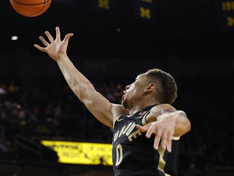 Feb 25, 2024; Ann Arbor, Michigan, USA;  Purdue Boilermakers forward Mason Gillis (0) goes for the rebound in the second half against the Michigan Wolverines at Crisler Center. Mandatory Credit: Rick Osentoski-USA TODAY Sports