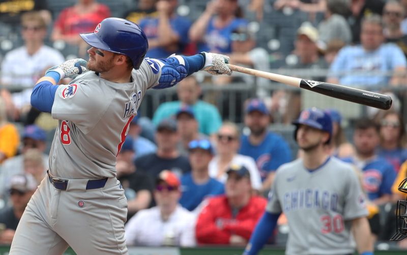 May 1, 2025; Pittsburgh, Pennsylvania, USA;  Chicago Cubs left fielder Ian Happ (8) hits an RBI single against the Pittsburgh Pirates during the ninth inning at PNC Park. Mandatory Credit: Charles LeClaire-Imagn Images