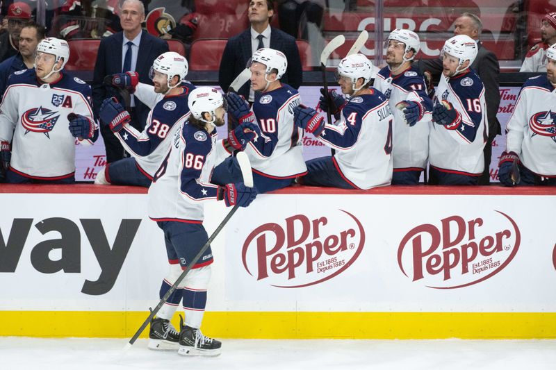 Dec 29, 2025; Ottawa, Ontario, CAN; Columbus Blue Jackets right wing Kirill Marchenko (86) celebrates with team his goal scored in the third period against the Ottawa Senators at the Canadian Tire Centre. Mandatory Credit: Marc DesRosiers-IMAGN Images