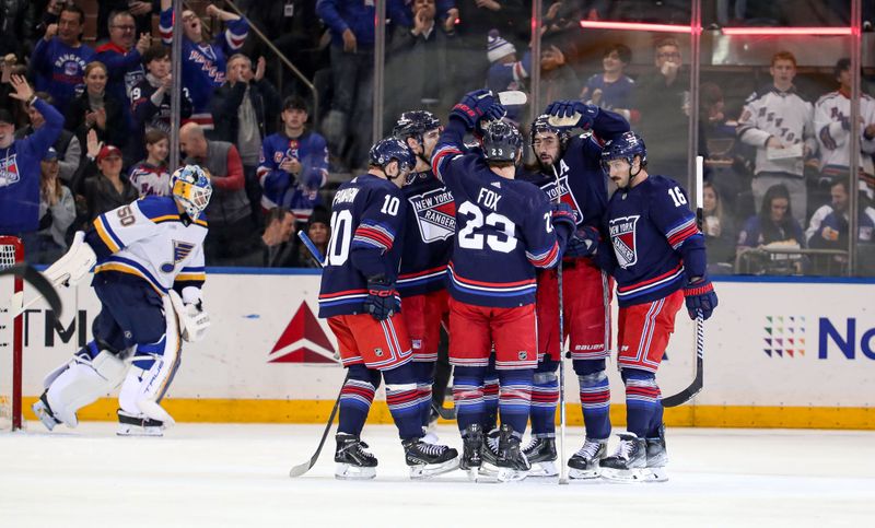 Mar 9, 2024; New York, New York, USA: New York Rangers center Vincent Trocheck (16) celebrates his goal with center Mika Zibanejad (93), defenseman Adam Fox (23) and left wing Artemi Panarin (10) during the first period against the St. Louis Blues at Madison Square Garden. Mandatory Credit: Danny Wild-USA TODAY Sports