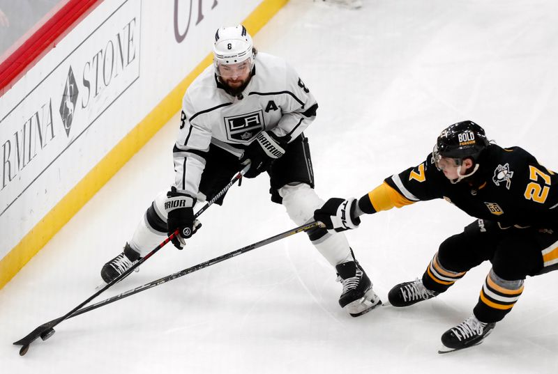 Feb 18, 2024; Pittsburgh, Pennsylvania, USA;  Pittsburgh Penguins defenseman Ryan Graves (27) defends Los Angeles Kings defenseman Drew Doughty (8) during the second perio at PPG Paints Arena. Mandatory Credit: Charles LeClaire-USA TODAY Sports