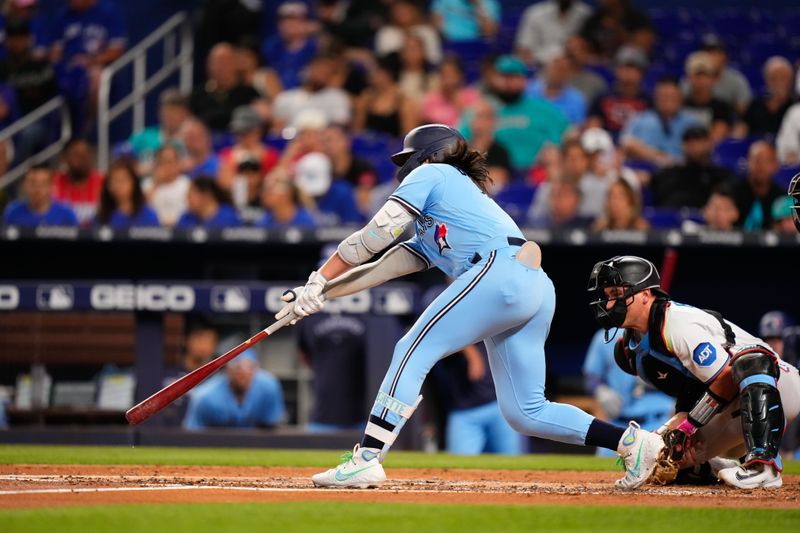 Jun 20, 2023; Miami, Florida, USA; Toronto Blue Jays second baseman Whit Merrifield (15) hits a single against the Miami Marlins during the fourth inning at loanDepot Park. Mandatory Credit: Rich Storry-USA TODAY Sports