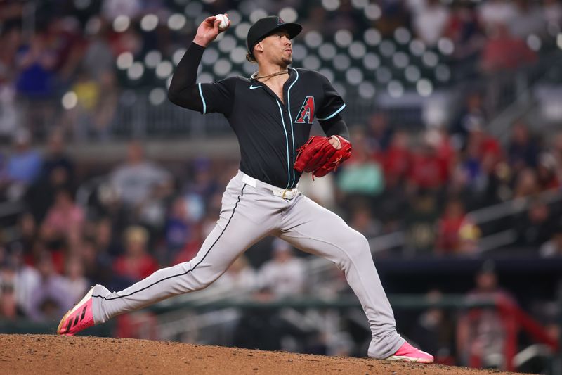 Jun 4, 2025; Atlanta, Georgia, USA; Arizona Diamondbacks relief pitcher Justin Martinez (63) throws against the Atlanta Braves in the ninth inning at Truist Park. Mandatory Credit: Brett Davis-Imagn Images