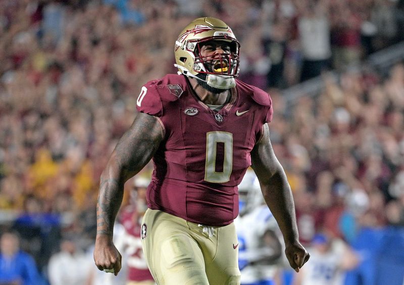 Oct 21, 2023; Tallahassee, Florida, USA; Florida State Seminoles defensive lineman Fabien Lovett (0) celebrates a defensive stop against the Duke Blue Devils in the second half at Doak S. Campbell Stadium. Mandatory Credit: Melina Myers-USA TODAY Sports