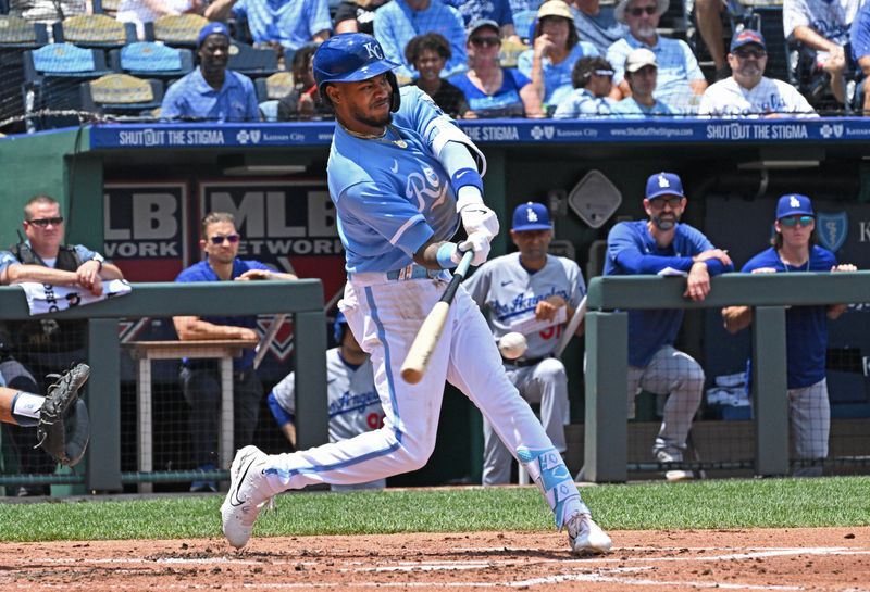 Jul 2, 2023; Kansas City, Missouri, USA;  Kansas City Royals third baseman Maikel Garcia (11) hits an RBI single in the second inning against the Los Angeles Dodgers at Kauffman Stadium. Mandatory Credit: Peter Aiken-USA TODAY Sports