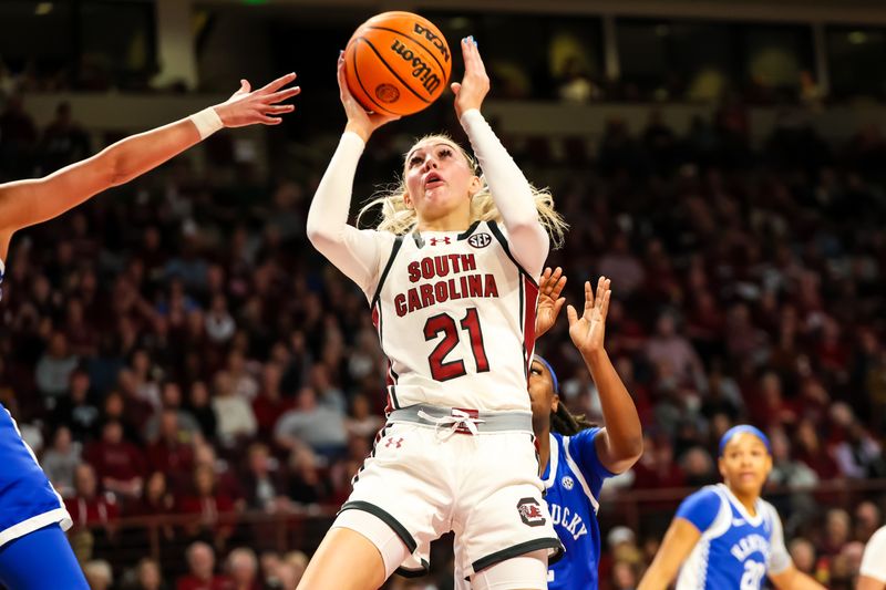 Jan 15, 2024; Columbia, South Carolina, USA; South Carolina Gamecocks forward Chloe Kitts (21) shoots against the Kentucky Wildcats in the first half at Colonial Life Arena. Mandatory Credit: Jeff Blake-USA TODAY Sports