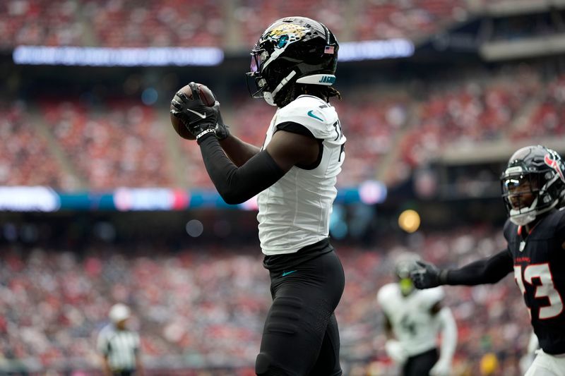 Jacksonville Jaguars wide receiver Brian Thomas Jr. catches a 2-yard touchdown pass during the first half of an NFL football game against the Houston Texans, Sunday, Sept. 29, 2024, in Houston. (AP Photo/Eric Gay)