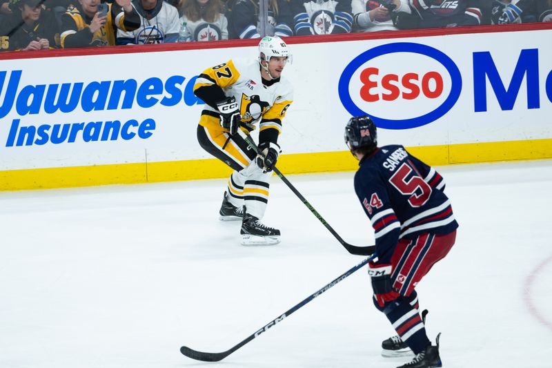 Feb 10, 2024; Winnipeg, Manitoba, CAN;  Pittsburgh Penguins forward Sidney Crosby (87) looks to make a pass by Winnipeg Jets defenseman Dylan Samberg (54) during the third period at Canada Life Centre. Mandatory Credit: Terrence Lee-USA TODAY Sports