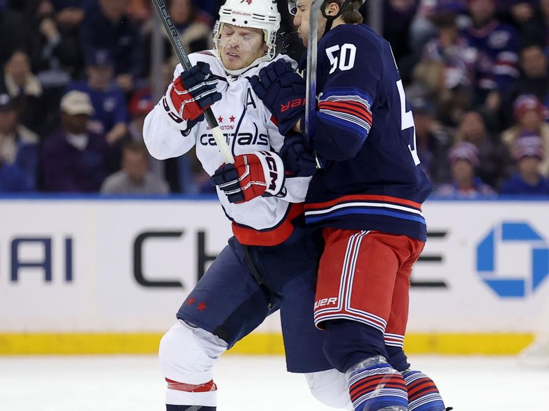 Jan 14, 2024; New York, New York, USA; New York Rangers left wing Will Cuylle (50) hits Washington Capitals defenseman John Carlson (74) during the third period at Madison Square Garden. Mandatory Credit: Brad Penner-USA TODAY Sports