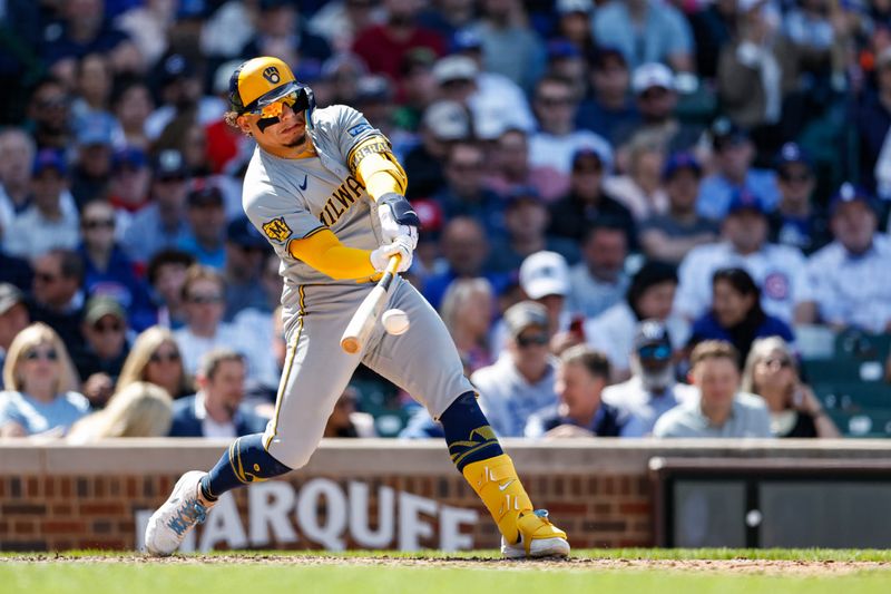 May 3, 2024; Chicago, Illinois, USA; Milwaukee Brewers catcher William Contreras (24) hits an RBI-single against the Chicago Cubs during the eight inning at Wrigley Field. Mandatory Credit: Kamil Krzaczynski-USA TODAY Sports