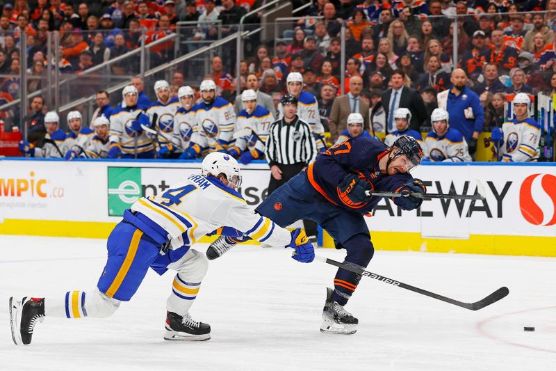 Mar 21, 2024; Edmonton, Alberta, CAN; Edmonton Oilers forward Warren Foegele (37) gets a shot away in front of Buffalo Sabres defensemen Bowen Byron (4) during the first period at Rogers Place. Mandatory Credit: Perry Nelson-USA TODAY Sports