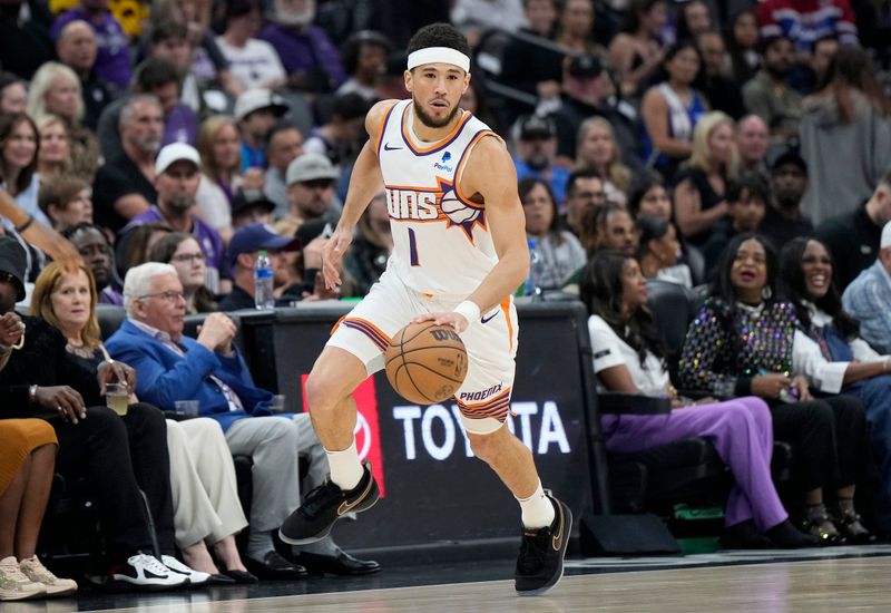 SACRAMENTO, CALIFORNIA - APRIL 12: Devin Booker #1 of the Phoenix Suns dribbles the ball up court against the Sacramento Kings during the first half of an NBA basketball game at Golden 1 Center on April 12, 2024 in Sacramento, California. NOTE TO USER: User expressly acknowledges and agrees that, by downloading and or using this photograph, User is consenting to the terms and conditions of the Getty Images License Agreement. (Photo by Thearon W. Henderson/Getty Images)